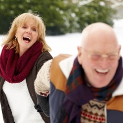 Older Couple Playing in Snow